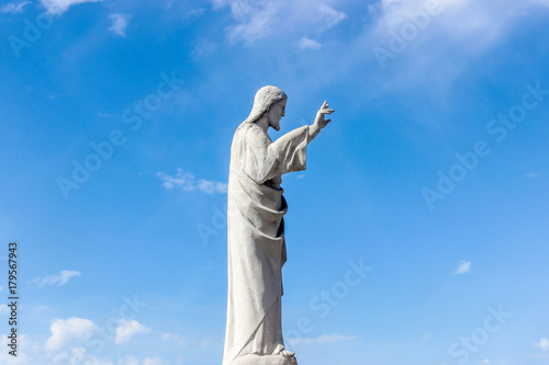 statue of jesus in blue sky at Notre-Dame de la Garde church	