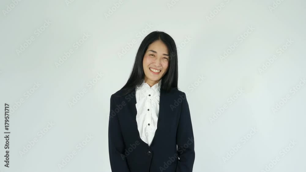 Cheerful Young business woman showing thumb up and smiling at camera Cheerful Young business woman showing thumb up and smiling at camera