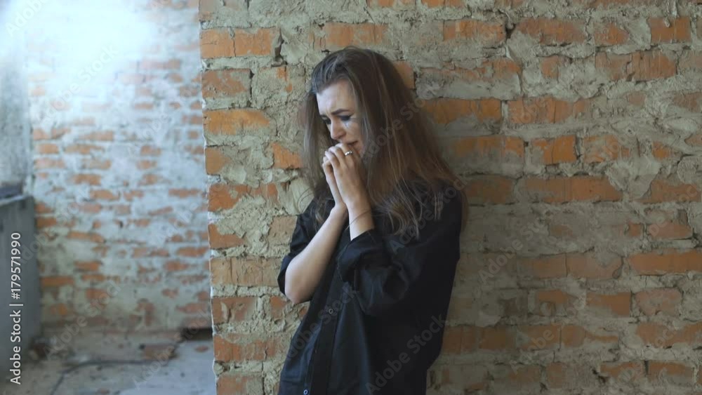 Beautiful sad woman crying in the building 4K Beautiful sad woman crying in the building 4K