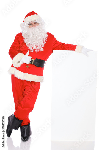 Santa Claus standing with thumbs up or ok isolated on white background. Full length portrait