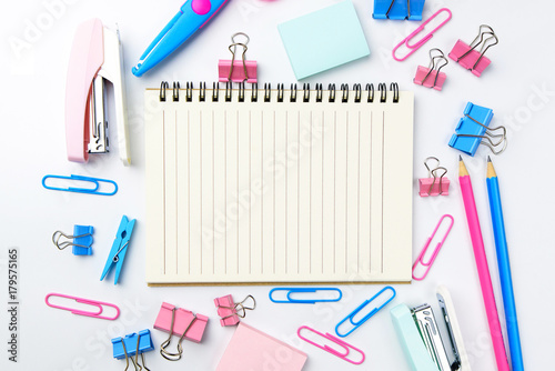 Stationary concept, Flat Lay top view Photo of school supplies scissors, pencils, paper clips,calculator,sticky note,stapler and notepad in pastel tone on white background with copy space, flat lay