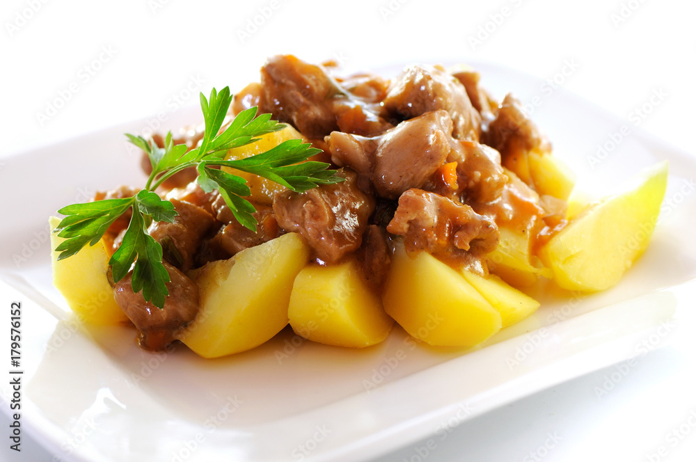 Goulash, beef stew with potatoes, isolated on white background.