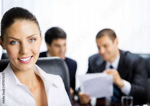 Portrait of happy smiling businesswoman at office