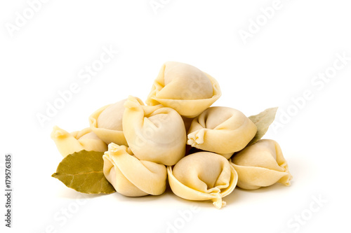 Dumplings with Laurel leaves on a white