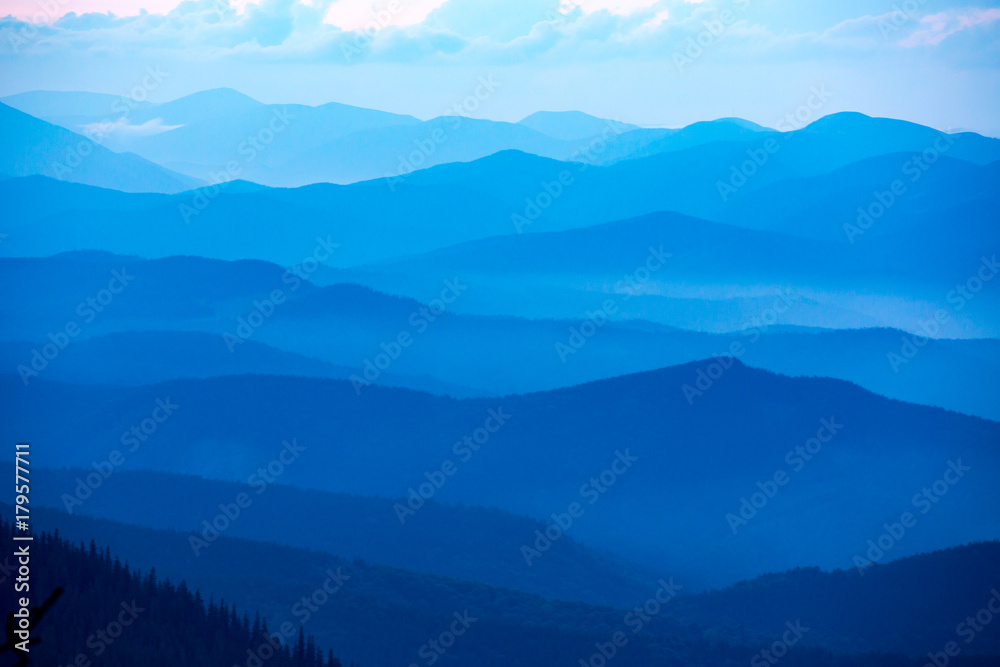 blue misty valley in mountains