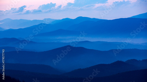 Evening valley with blue mist
