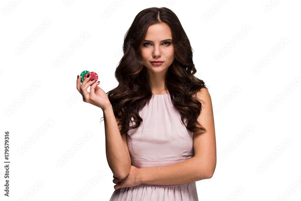 Sexy curly hair brunette posing with chips in her hands, poker concept isolation on white background Sexy curly hair brunette posing with chips in her hands, poker concept isolation on white background