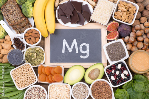 Magnesium food sources, top view on wooden background