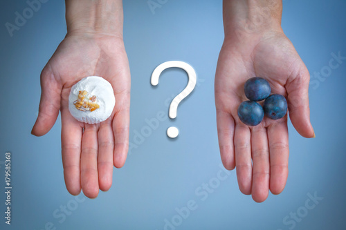 Choice between merengue and blueberries (concept)