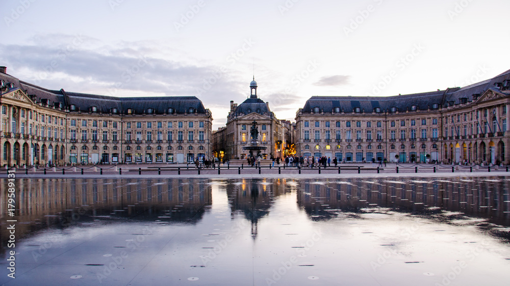 Evening water reflection of the Bourse Place in Bordeaux