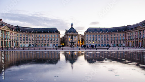 Evening water reflection of the Bourse Place in Bordeaux