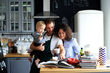 Young family preparing lunch in the kitchen
