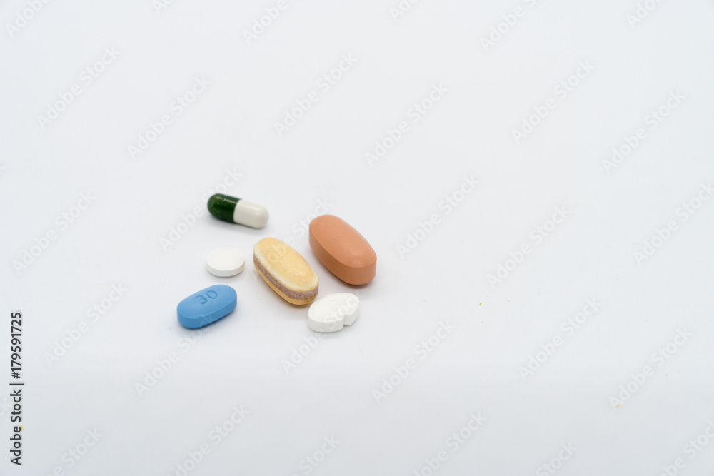 six medicine pills in many colours on white background six medicine pills in many colours on white background