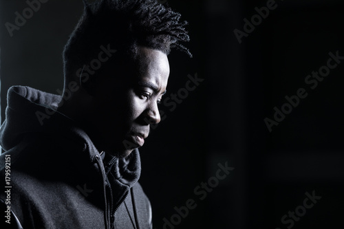 African man profile portrait in dark