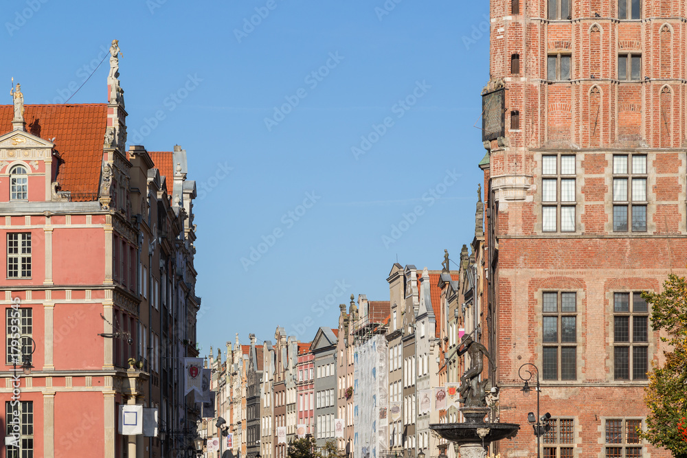 View of Main Town Hall and other old buildings along the Long Market Street (Long Lane) at the Main Town (Old Town) in Gdansk, Poland, on a sunny day.