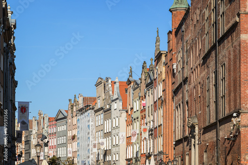 View of Main Town Hall and other old buildings along the Long Market Street (Long Lane) at the Main Town (Old Town) in Gdansk, Poland, on a sunny day.