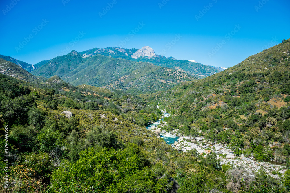 Picturesque mountain river valley and rocks in the Kings Canyon Preserve, California. Picturesque mountain river valley and rocks in the Kings Canyon Preserve, California.