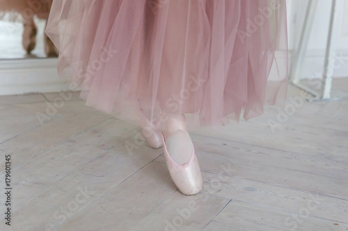 Ballerina puts pointe shoes photo