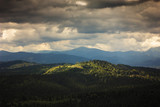 Summer mountain landscape. Hoverla under dramatic cloudy sky. Traveling in Carpathians, Ukraine
