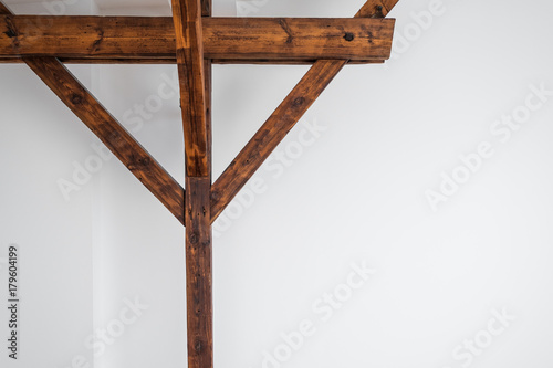 Fotografie wooden roof beam / framework  and white wall background