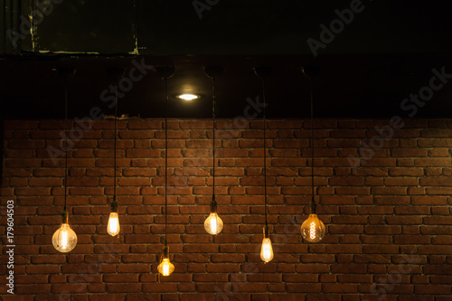 Light bulbs on brick wall