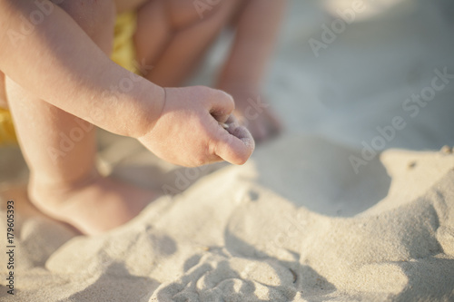 The hand of a baby in the sea