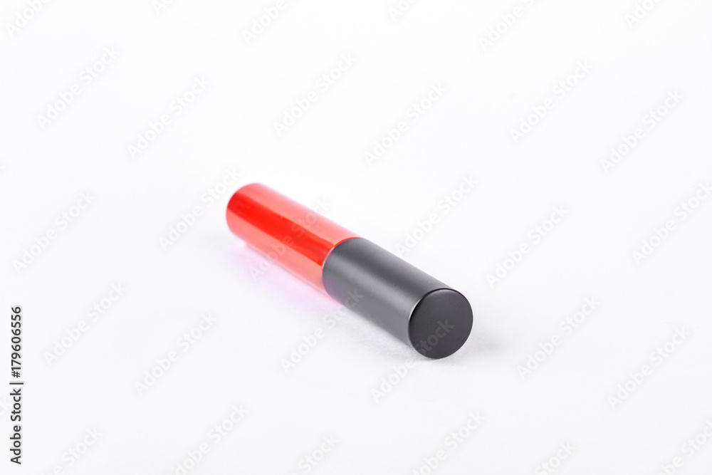 Red liquid lipstick with black cap. Beautiful red liquid lipstick isolated on white background. Woman makeup accessory. Red liquid lipstick with black cap. Beautiful red liquid lipstick isolated on white background. Woman makeup accessory.
