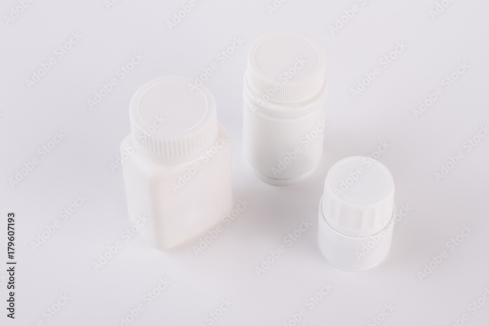 Three plastic bottles for pills. Blank medicine bottles isolated on white background. Three plastic bottles for pills. Blank medicine bottles isolated on white background.