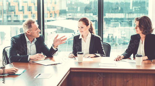 Business partners discussing documents