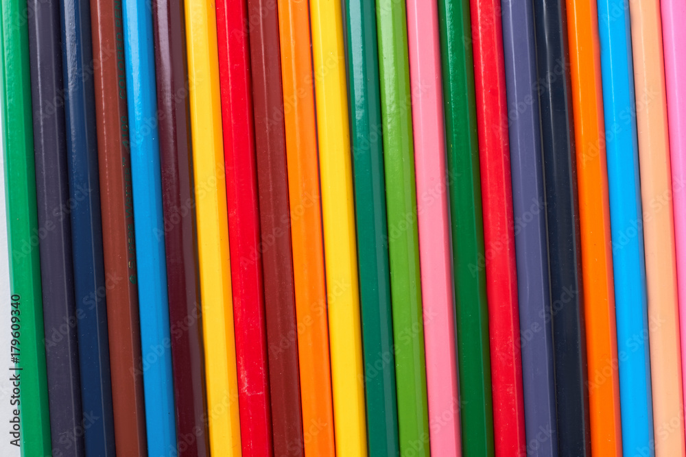 Multicolored pencils background. Background of colored wooden pencils for art.