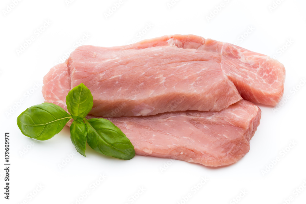 Fresh pork fillet with basil on a white background. Fresh pork fillet with basil on a white background.