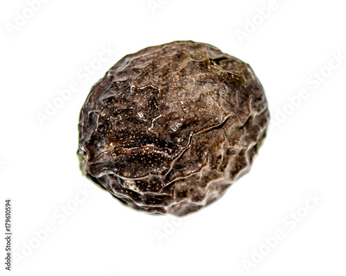 Walnuts in green peel on a white background