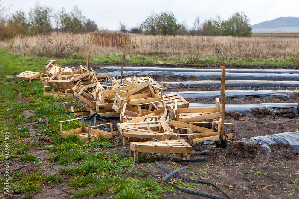 Pile of wooden boxes at the side of agriculture field Pile of wooden boxes at the side of agriculture field