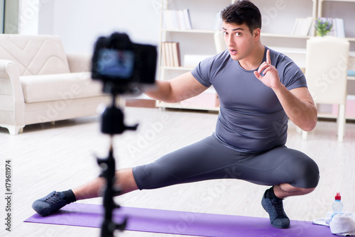 Sports and health blogger recording video in sport concept