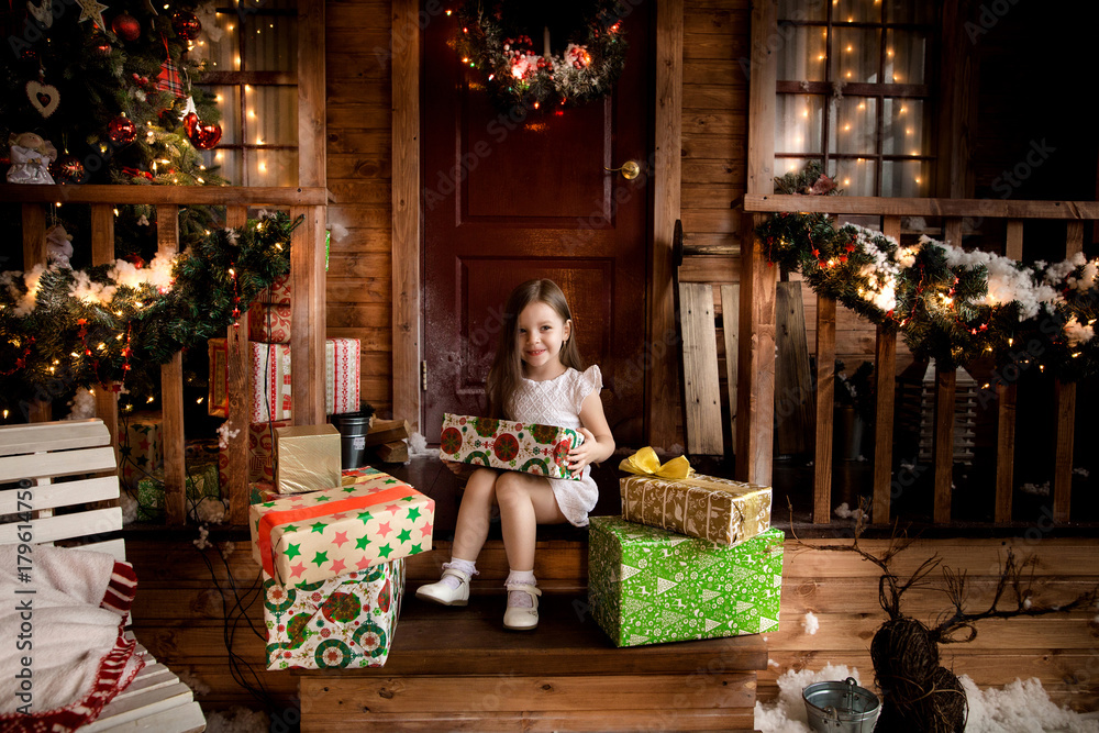 little smiling girl with christmas gift box.