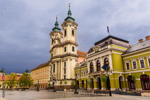 Eger main square in Hungary  Europe with dark moody sky and catholic cathedral. Travel outdoor european background