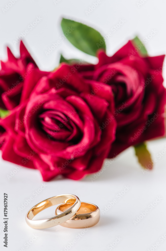 Wedding concept with rings and roses Wedding concept with rings and roses
