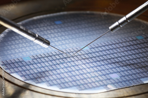 manufacture of chips on a printed circuit board under a microscope photo