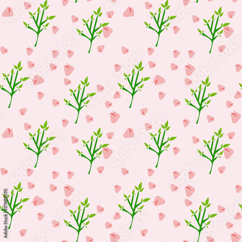 Fototapeta Naklejka Na Ścianę i Meble -  rami verdi e fiori rosa su sfondo rosa
