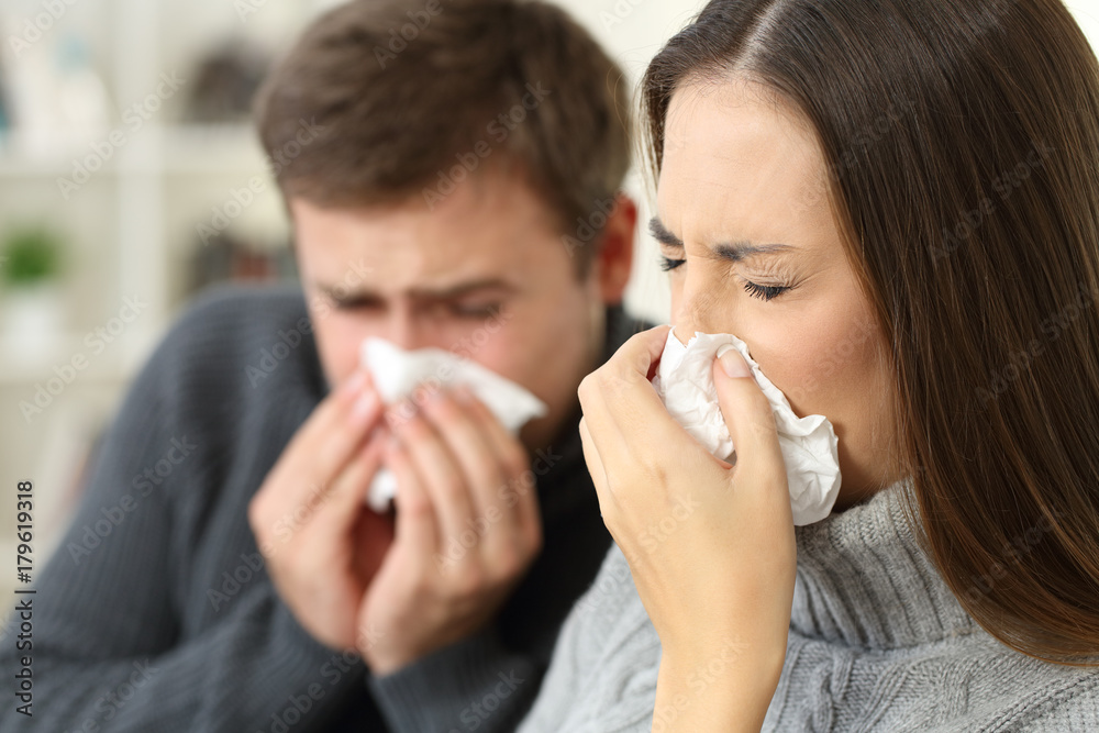 Ill couple coughing at home Ill couple coughing at home
