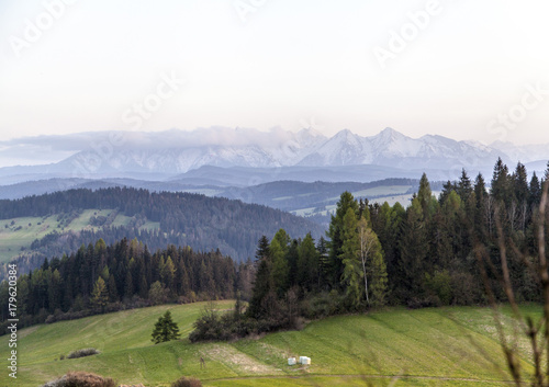 beautiful sunset with the mountains landscape on the spring time