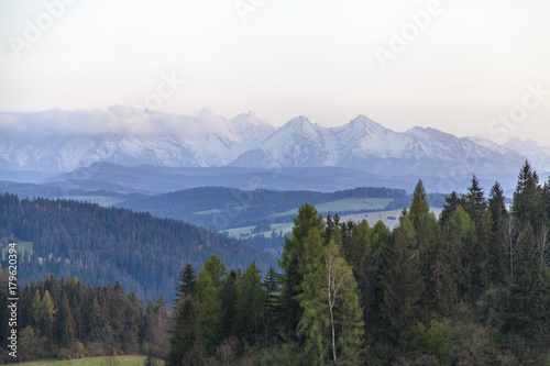 beautiful sunset with the mountains landscape on the spring time