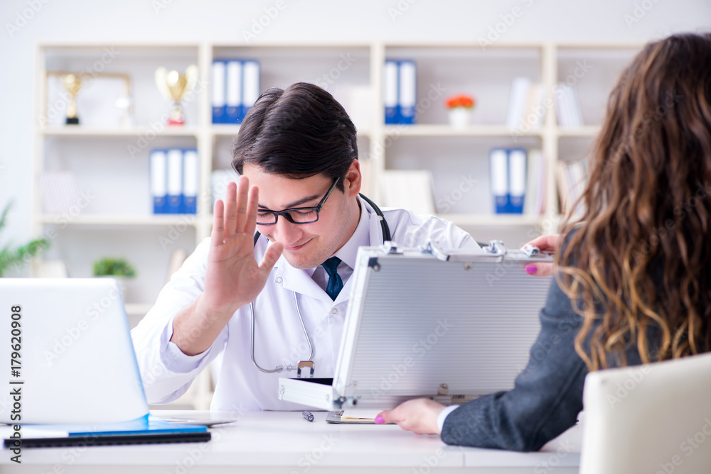 Young doctor in medical insurance fraud concept Young doctor in medical insurance fraud concept