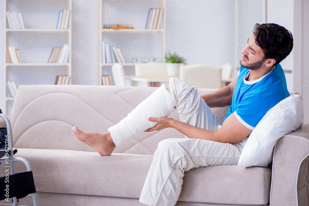 Injured young man recovering at home Injured young man recovering at home