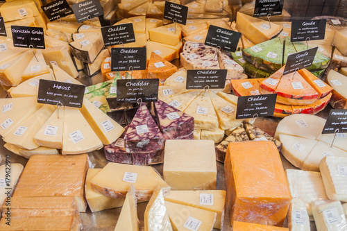 Canvas Print Variety of cheese at a stall inTorvehallerne indoor food market in the centre of