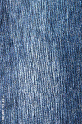 Close up shot of blue worn denim jeans fabric
