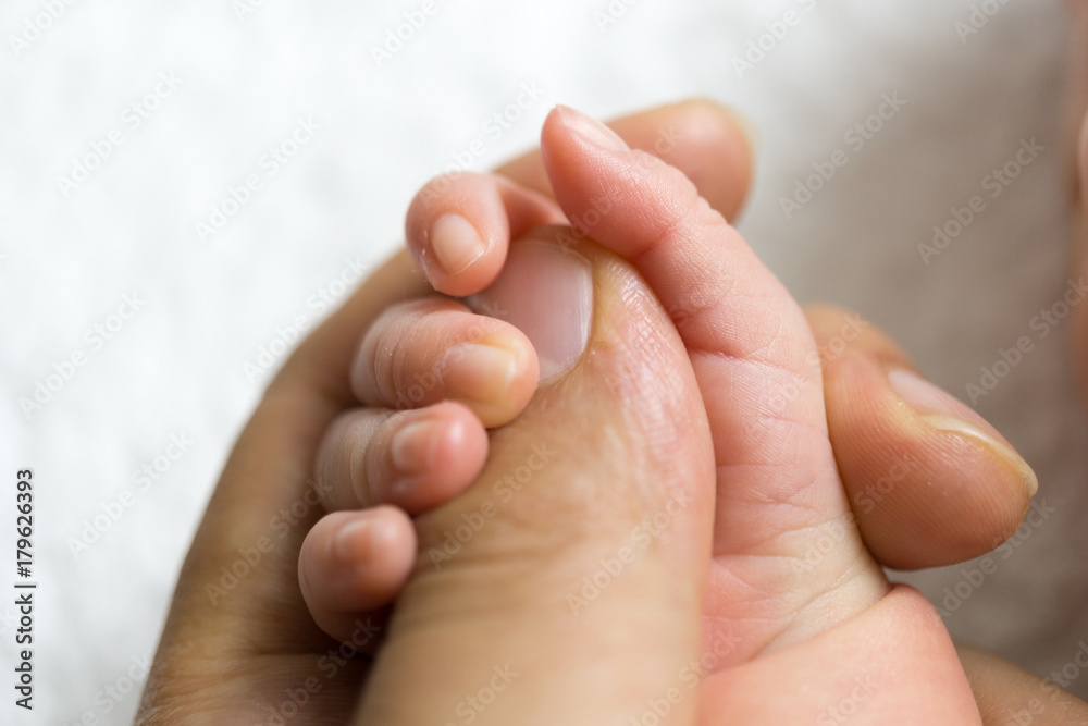 Newborn baby touching his father hand Newborn baby touching his father hand