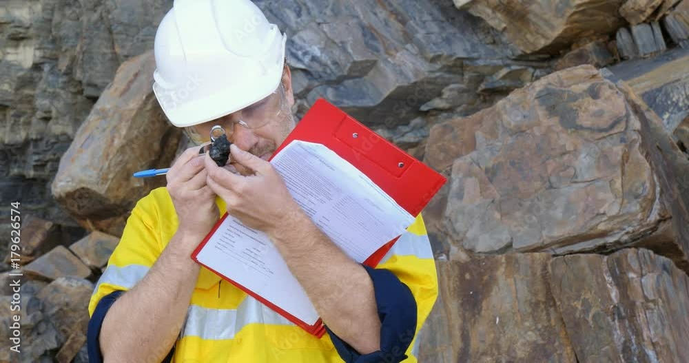Geochemist Geologist taking field notes about geology in mineral exploration