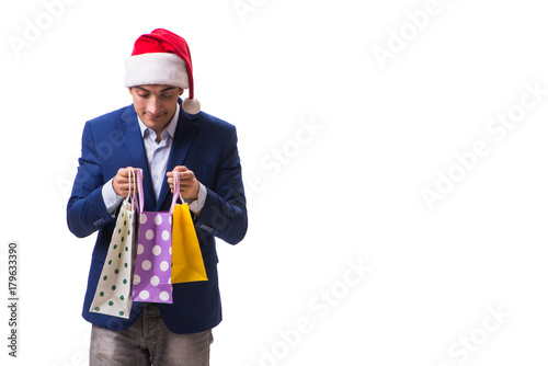 Young man with bags after christmas shopping on white background