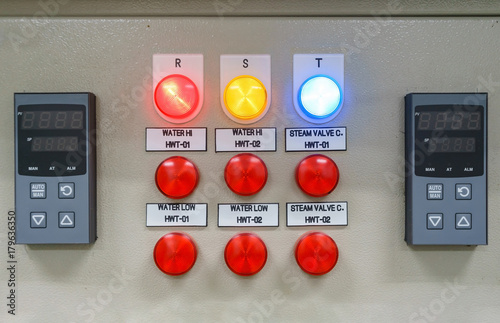 Technical display on control panel with electrical equipment devices cabinet, light photo